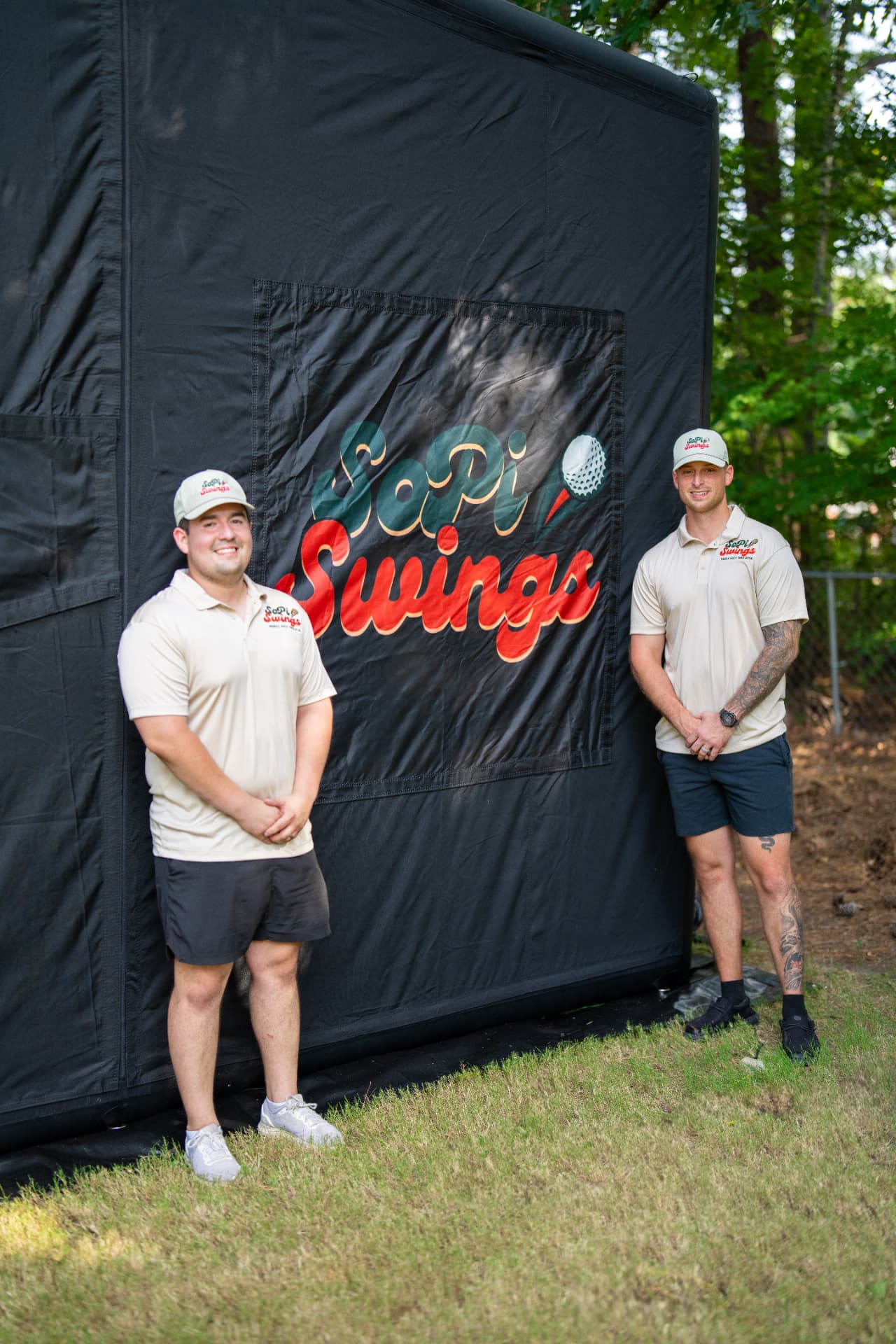 Anthony and Jordan in front of the SoPi Swings inflatable simulator